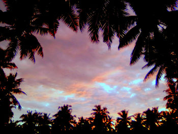 Low angle view of silhouette trees against sky at sunset