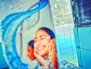 Portrait of man holding swimming pool