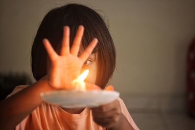 Cropped hand of woman with arms raised