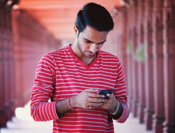 Young man using mobile phone