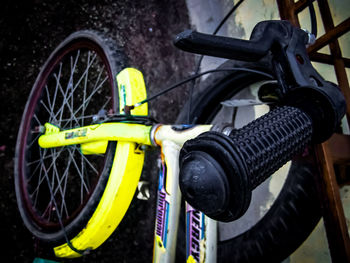 Close-up of bicycle parked in field