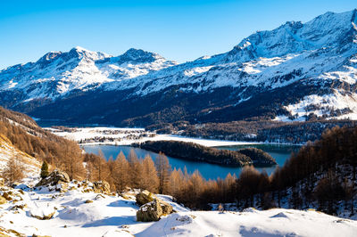 The village of sils maria, in engadine, switzerland, photographed from above in winter, with snow.