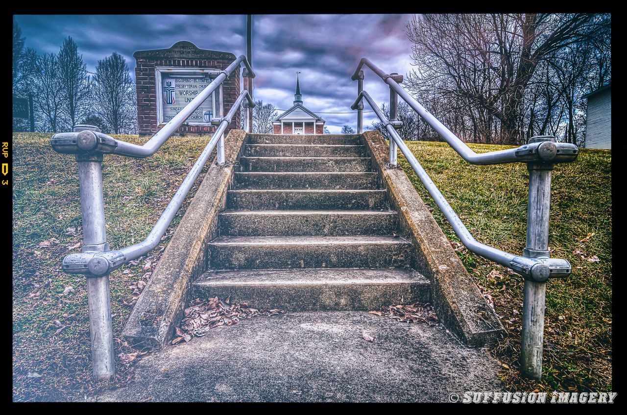 transfer print, auto post production filter, steps, railing, steps and staircases, sky, staircase, built structure, architecture, low angle view, the way forward, metal, tree, day, cloud - sky, no people, outdoors, diminishing perspective, sunlight, building exterior