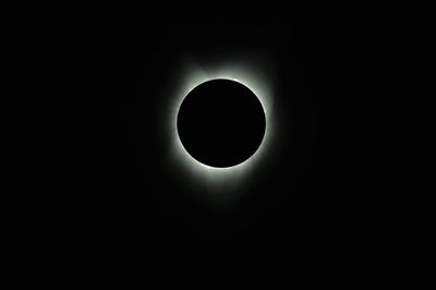 Low angle view of silhouette moon against sky at night