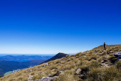 Scenic view of mountains against clear blue sky