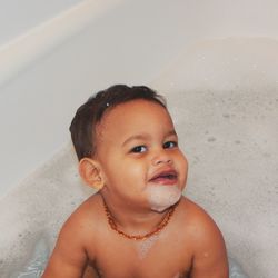 High angle portrait of toddler playing in bathtub