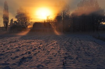 Scenic view of landscape against sky during sunset