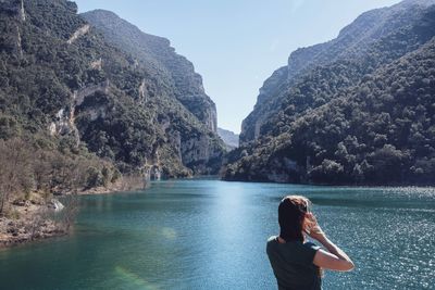 Rear view of woman looking at mountains