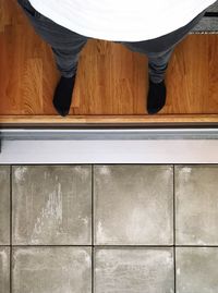 Low section of man standing on floor