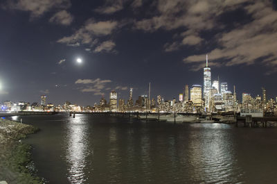 Illuminated city at waterfront