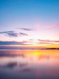 Scenic view of sea against romantic sky during sunset