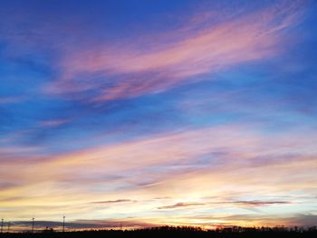 Low angle view of dramatic sky during sunset