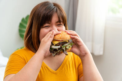 Portrait of woman eating food