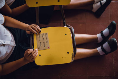 Low section of student with chair