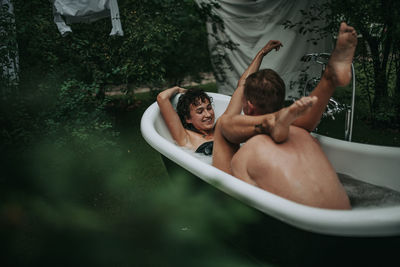 Young couple kissing in water