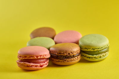Close-up of candies against yellow background