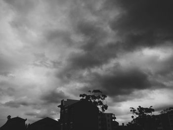 Low angle view of building against cloudy sky