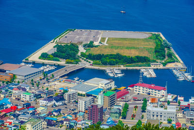 High angle view of cityscape by sea