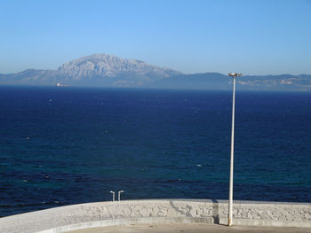 Scenic view of sea against clear blue sky