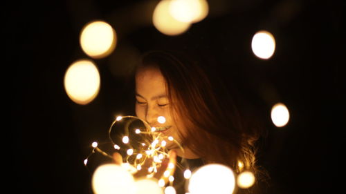 Close-up of illuminated light at night