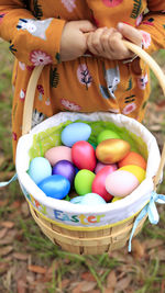 Close-up of multi colored eggs in basket