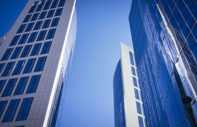 Low angle view of tower against blue sky