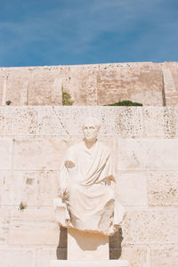 Statue at acropolis during sunny day