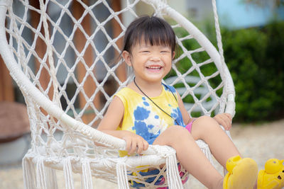 Portrait of cute girl smiling outdoors