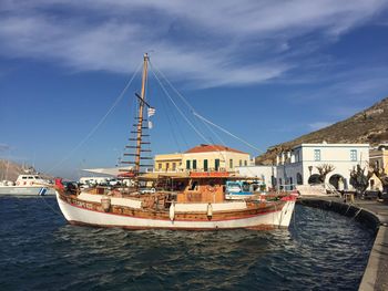 Boats moored on sea against sky