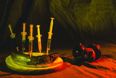 Close-up of illuminated candles on table