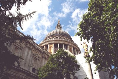 Low angle view of building against cloudy sky