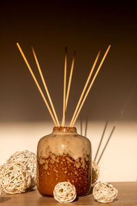 Cozy home decorations aroma reed diffuser in the living room. home comfort concept. bottle container