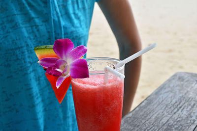 Close-up of hand holding drink