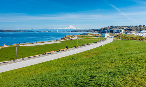 A panoramic view of dune peninsula park with mount rainier in the distance.