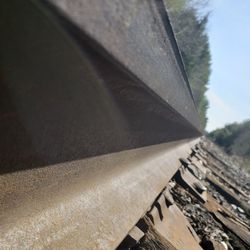 Close-up of railroad track against sky