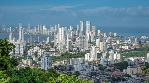 Modern buildings in city against sky