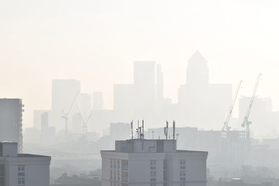 Buildings in city against sky