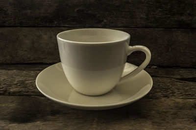 Close-up of coffee cup on table