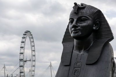 Low angle view of statue against sky