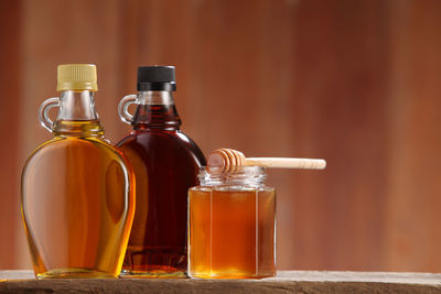 Close-up of honey in jars on table