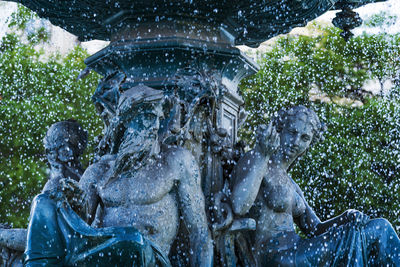 Statue of people in rain