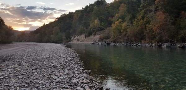 Scenic view of lake against sky during sunset