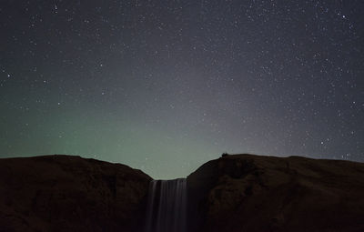 Low angle view of mountain against sky at night