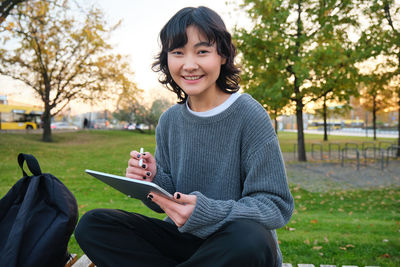 Young woman using mobile phone