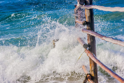 High angle view of water splashing in sea