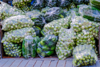 Stack of vegetables for sale at market stall