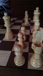 Close-up of chess pieces on table