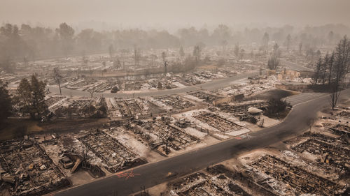 Human caused fire destroys hundreds of mobile homes and many assets.