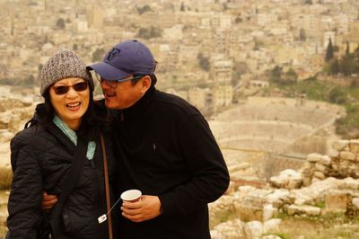 Young couple standing in city