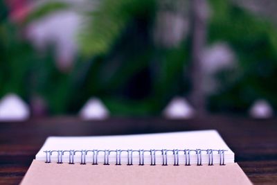 Close-up of open book on table at yard